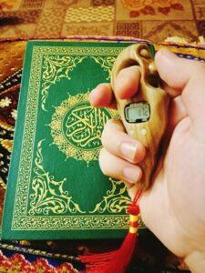 green 15 lines tajweedi Quran kareem and a golden colored, multifunctional tasbih prayer for men